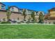 Beautifully landscaped park with benches, grass, trees and walking paths at 8958 Howell St, Las Vegas, NV 89166