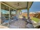 Covered patio with brick flooring, ceiling fan, and stylish outdoor furniture perfect for relaxing and entertaining at 8958 Howell St, Las Vegas, NV 89166