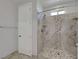 Modern bathroom features a tiled shower with a rainfall showerhead and built-in bench at 8958 Howell St, Las Vegas, NV 89166