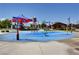 Colorful splash pad with playful water features, shaded seating, and a fun environment for  at 8958 Howell St, Las Vegas, NV 89166