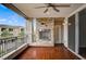 Covered balcony with stone fireplace and dark wood look tile at 9201 Tesoras Dr # 401, Las Vegas, NV 89144