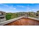 The balcony overlooks lush landscaping and residential architecture at 9201 Tesoras Dr # 401, Las Vegas, NV 89144