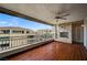 Covered balcony offers comfortable outdoor living with a stone fireplace at 9201 Tesoras Dr # 401, Las Vegas, NV 89144