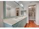 Well-lit bathroom featuring double sink vanity and walk-in closet at 9201 Tesoras Dr # 401, Las Vegas, NV 89144
