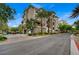 A street-level view of the building showcasing multiple floors and well-maintained landscaping at 9201 Tesoras Dr # 401, Las Vegas, NV 89144