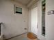 Entry to unit 401 featuring white door, small window, and a view through the side window at 9201 Tesoras Dr # 401, Las Vegas, NV 89144