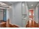 This hallway has hardwood floors and built in shelves and cabinets at 9201 Tesoras Dr # 401, Las Vegas, NV 89144