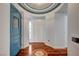 Hallway with detailed ceiling trim, hardwood floors and a view of the front door at 9201 Tesoras Dr # 401, Las Vegas, NV 89144