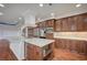 Modern kitchen island with a marble countertop, custom cabinets and stainless appliances at 9201 Tesoras Dr # 401, Las Vegas, NV 89144