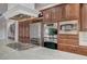 A gourmet kitchen features stainless steel appliances and custom cabinetry at 9201 Tesoras Dr # 401, Las Vegas, NV 89144
