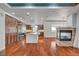 Modern kitchen featuring custom cabinets, stone countertops, stainless appliances and stone fireplace at 9201 Tesoras Dr # 401, Las Vegas, NV 89144