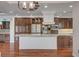 A modern kitchen with a central island and stainless steel appliances at 9201 Tesoras Dr # 401, Las Vegas, NV 89144