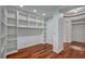 This office has hardwood floors, built-in shelves, recessed lighting, and white paint at 9201 Tesoras Dr # 401, Las Vegas, NV 89144