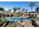 Enjoy a refreshing swim in this community pool lined with mature palm trees and verdant shrubbery at 9201 Tesoras Dr # 401, Las Vegas, NV 89144