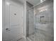 Modern shower with sliding glass door and tile surround at 9201 Tesoras Dr # 401, Las Vegas, NV 89144