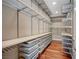 Well-organized walk-in closet with shelving and dark wood floors at 9201 Tesoras Dr # 401, Las Vegas, NV 89144