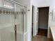 Bathroom showcasing a shower with glass door and built-in seat at 9236 Canalino Dr, Las Vegas, NV 89134