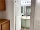 Powder room featuring wood cabinets and modern fixtures at 9236 Canalino Dr, Las Vegas, NV 89134