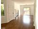 Bright living room with wood floors, fireplace, and sliding glass doors to a balcony at 9236 Canalino Dr, Las Vegas, NV 89134