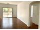 A bright, spacious living room with wood floors and sliding door access to the backyard at 9236 Canalino Dr, Las Vegas, NV 89134