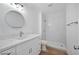 Modern bathroom with granite countertops, stylish lighting, and glass-enclosed shower at 9247 Tulip Trestle Ave, Las Vegas, NV 89148