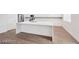Kitchen island with white countertop, and stainless steel appliances at 9247 Tulip Trestle Ave, Las Vegas, NV 89148
