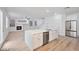 Open concept kitchen with white island and stainless steel appliances at 9247 Tulip Trestle Ave, Las Vegas, NV 89148