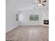 Spacious living room with fireplace and ample natural light from large windows at 9247 Tulip Trestle Ave, Las Vegas, NV 89148