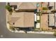 An aerial view of a single Gathering home with artificial turf and a small backyard pool at 9430 Isla Lee Ave, Las Vegas, NV 89178