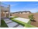 Backyard featuring a patio, desert landscaping, and privacy wall at 9430 Isla Lee Ave, Las Vegas, NV 89178