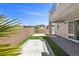 Spacious backyard with desert landscaping and a covered patio at 9430 Isla Lee Ave, Las Vegas, NV 89178