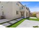 Landscaped backyard with patio and artificial turf at 9430 Isla Lee Ave, Las Vegas, NV 89178