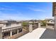Balcony featuring community views, dark metal railings, and neutral columns at 9430 Isla Lee Ave, Las Vegas, NV 89178