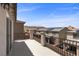 Balcony with views of neighborhood and desert landscape in background at 9430 Isla Lee Ave, Las Vegas, NV 89178