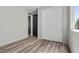 Minimalist bedroom with sleek floors, closet, and neutral color palette at 9430 Isla Lee Ave, Las Vegas, NV 89178