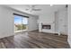Bright bedroom with fireplace feature, ceiling fan, and balcony access at 9430 Isla Lee Ave, Las Vegas, NV 89178