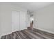 Bright bedroom with modern wood floors and a closet with sliding doors at 9430 Isla Lee Ave, Las Vegas, NV 89178