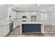 Modern kitchen with center island, stainless appliances, and ample cabinet space at 9430 Isla Lee Ave, Las Vegas, NV 89178