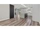 Kitchen featuring wood floors and central island in an open concept space at 9430 Isla Lee Ave, Las Vegas, NV 89178