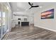 Open-concept space featuring a kitchen, living area, and sliding doors to an outdoor space at 9430 Isla Lee Ave, Las Vegas, NV 89178