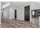 Living room featuring wood floors and fireplace in an open concept space at 9430 Isla Lee Ave, Las Vegas, NV 89178