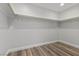 Walk-in closet featuring light walls, white trim, and luxury vinyl plank flooring at 9430 Isla Lee Ave, Las Vegas, NV 89178