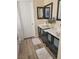 This bathroom has dual vanities with square sinks and black framed mirrors at 9589 Comiskey Ct, Las Vegas, NV 89148