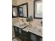 This bathroom has dual vanities with square sinks and black framed mirrors at 9589 Comiskey Ct, Las Vegas, NV 89148
