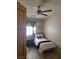 Bright bedroom with wood look floors, ceiling fan and comfortable single bed at 9589 Comiskey Ct, Las Vegas, NV 89148