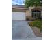 Charming home with a two-car garage, lovely landscaping, and curb appeal at 9589 Comiskey Ct, Las Vegas, NV 89148