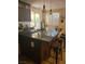 The kitchen has a large island, granite countertops, and stainless steel appliances at 9589 Comiskey Ct, Las Vegas, NV 89148