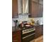 The kitchen features stainless steel appliances and dark wood cabinets at 9589 Comiskey Ct, Las Vegas, NV 89148