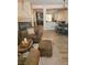 Comfortable living room with fireplace, dining area, and open floor plan at 9589 Comiskey Ct, Las Vegas, NV 89148