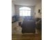 Spacious living room with comfortable seating, rug, home office and natural light at 9589 Comiskey Ct, Las Vegas, NV 89148